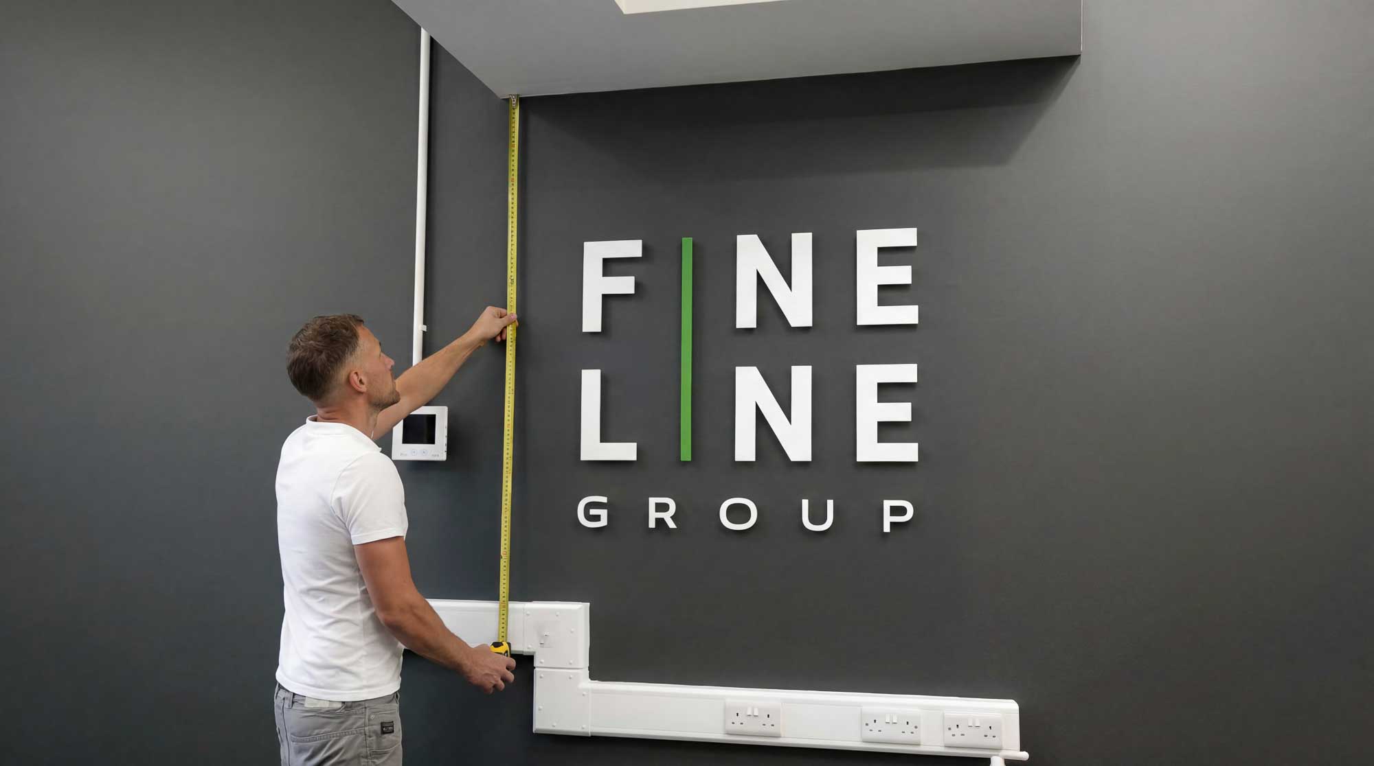 Measuring wall for sign logo on site
