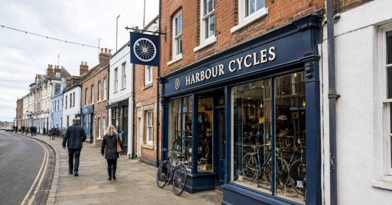 Harbour Cycles fascia and projecting sign on a British high street